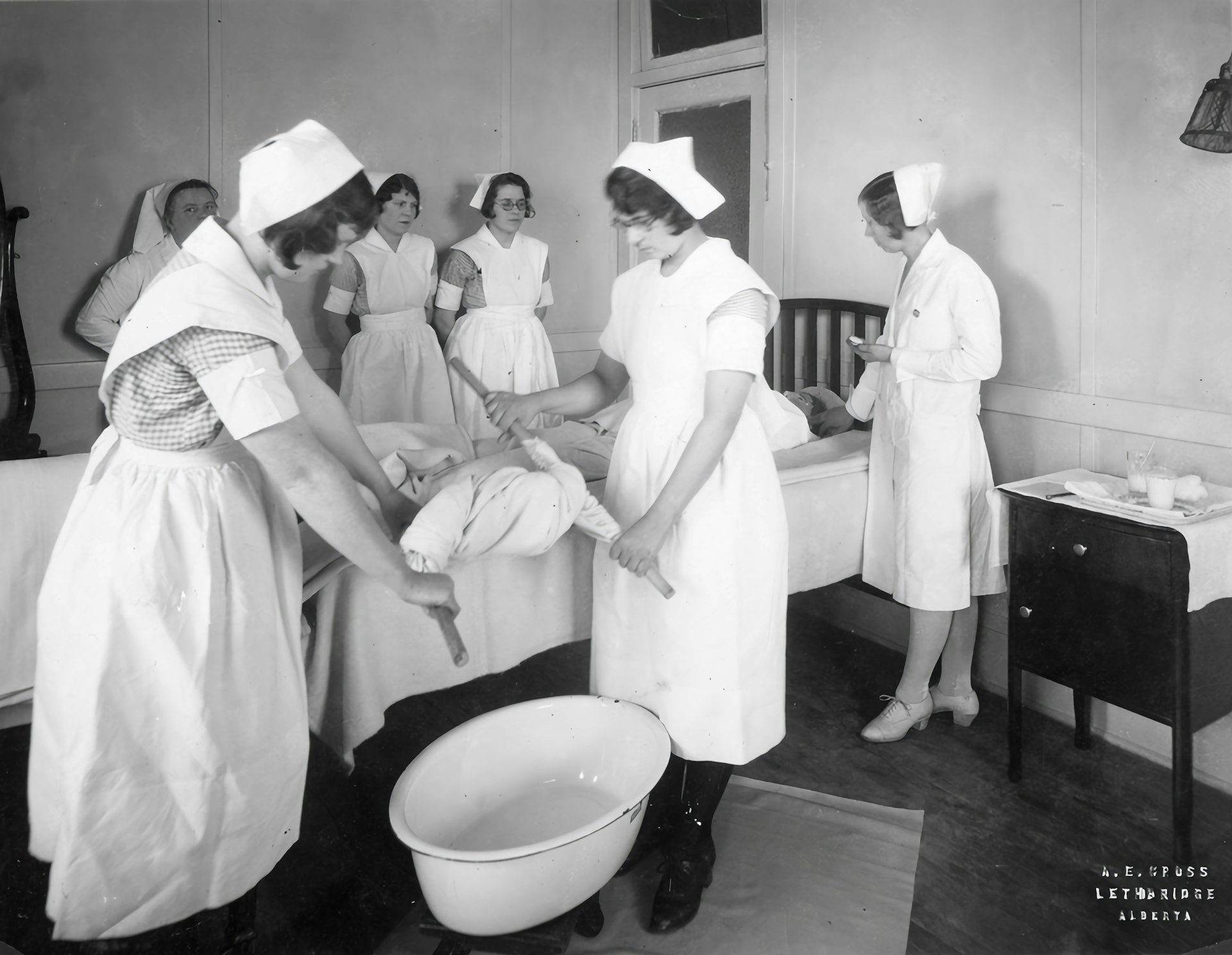 a black and white photo of a group of nurses